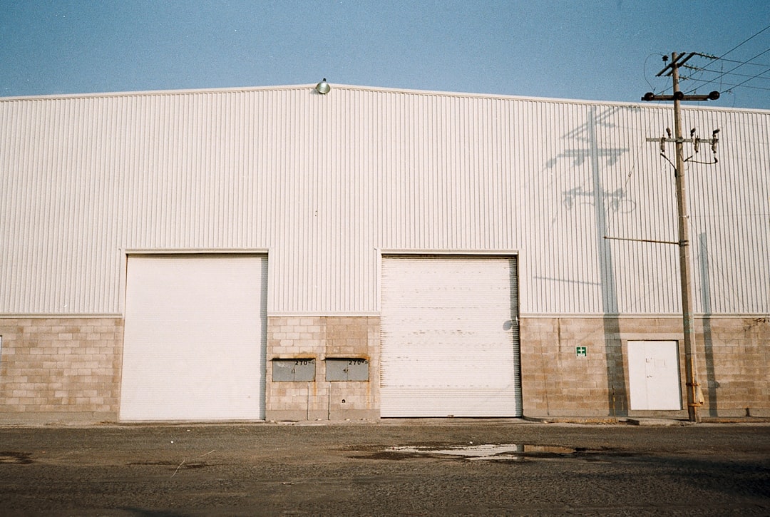 Industrial warehouse building with dock doors representing key valuation factors for industrial property