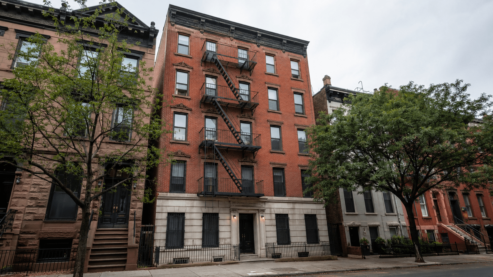 NYC multifamily apartment building exterior with fire escapes Brooklyn