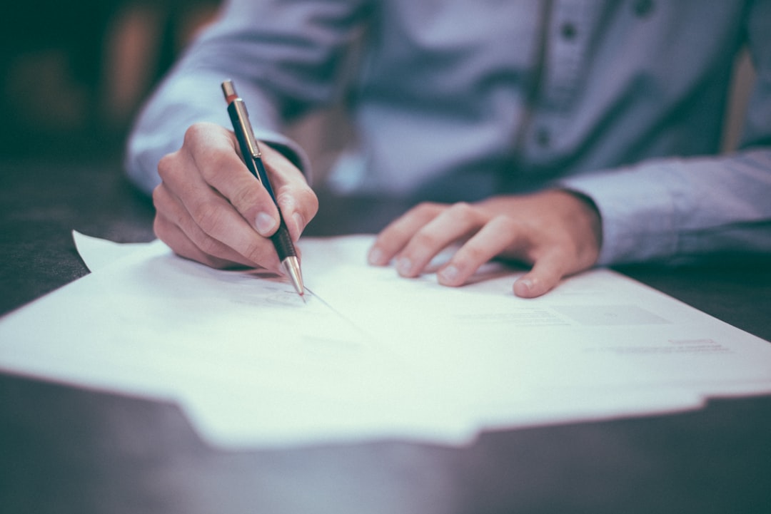 Professional signing documents representing broker opinion of value for estate planning and commercial property probate