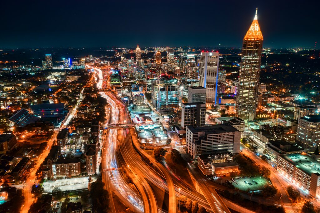 What Is My Atlanta Multifamily Property Worth? 2 Downtown Atlanta Georgia skyline at night representing Atlanta multifamily commercial real estate
