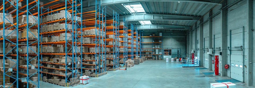 Modern logistics warehouse building with loading docks representing Seattle industrial property broker opinion of value