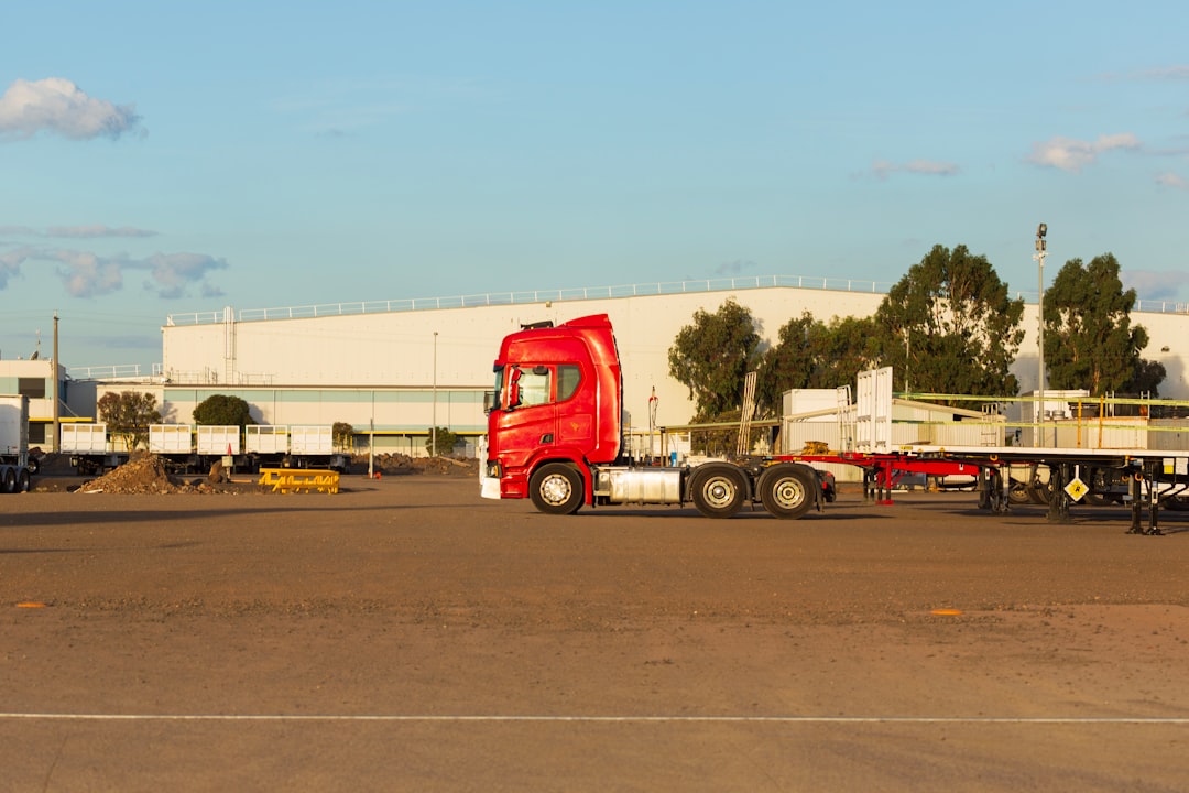Semi trailer truck in industrial yard representing Toledo industrial property broker opinion of value